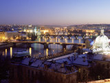 Snow Covered Bridges Across Vltava River Dividing Old Town from Mala Strana Suburbs, Czech Republic Photographie par Richard Nebesky