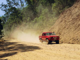 A Red 4X4 Pick-Up on the Dusty Bloomfield Track, Australia Photographie par Fraser Hall