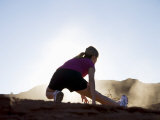 Woman Stretching, Monument Valley Navajo Tribal Park, Arizona Utah Border Photographie par Angelo Cavalli