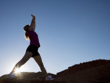 Woman Stretching, Monument Valley Navajo Tribal Park, Arizona Utah Border Photographie par Angelo Cavalli