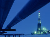 Alaska Oil Pipeline and Oil Rig at Night Photographie par Kenneth Garrett