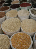 Bags of Mexican Beans and Corn at an Outdoor Market, San Cristobal de Las Casas, Mexico Photographic Print by Gina Martin