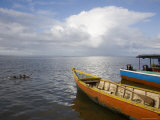 Children Play in Rive by Colorful Boats, Rio San Juan, Nicaragua Photographie par David Evans