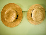 Amish Hats Hanging on a Wall, Pennsylvania Photographic Print by Tim Laman