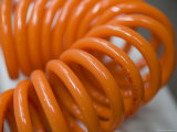 Coiled, Orange Air Hose at a Printing Plant in Hubei Province, China Photographie par David Evans