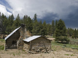 Image of Old Cabin and Fences of Olivas Camp with Approaching Storm, California Photographic Print by Rich Reid