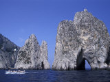 Faraglioni Rocks with a Boat in the Bay of Naples at Capri Island in Italy Photographic Print by Richard Nowitz