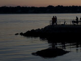 Fishermen Silhouetted by the Sunset on a Pier, Groton, Connecticut Photographic Print by Todd Gipstein