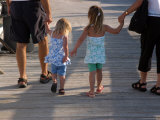 Grandchildren Walk Down a Wooden Pier with their Grandparents Photographic Print by Stacy Gold