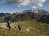 Hikers Descend a Trail to Pordoi Pass in the Dolomites, Italy Photographic Print by Bill Hatcher