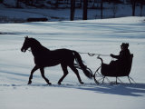 Horse-Drawn Sleigh Ride at Twilight in a Snowy Landscape Photographic Print by Ira Block
