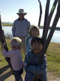 Kids Climb a Tree as their Grandpa Looks On, Washington, D.C. Fotografie-Druck von Stacy Gold