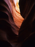 Narrow Slot Canyon Glows with Reflected Sunlight Photographic Print by Bill Hatcher