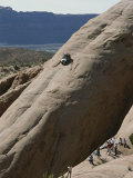 Jeep Drives Down a Slick Rock Formation Called Lion's Back, Utah Fotoprint van James P. Blair Jeep Drives Down a Slick Rock Formation Called Lion's Back, Utah Fotoprint van James P. Blair