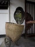 Hands Reach for Basket Cart in Front of Traditional Chinese Window, Jingzhou, China Photographie par David Evans