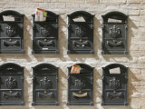 Mailboxes Lined on a Stone Wall, Ravenna, Italy Photographic Print by Gina Martin