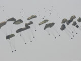 Paratrooper Supplies Coming Down under Parachutes Photographie par Skip Brown