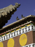 Pigeons on Roof of Buddhist Monastery, with Carved Dragon Detail, Qinghai, China Photographic Print by David Evans