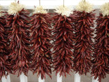 Red Peppers Hung Up to Dry, New Mexico Photographic Print by Joel Sartore
