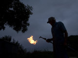 Man Holds a Welding Torch at his Farm near Cortland, Nebraska Photographic Print by Joel Sartore