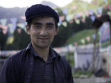 Portrait of a Local Man in a Cap, Qinghai, China Photographie par David Evans