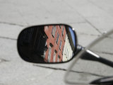 Reflection of Exterior Buildings from a Rear View Motorcycle Mirror, Parma, Italy Photographic Print by Gina Martin