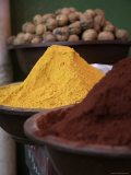 Red and Yellow Spices and Walnuts in Bowls at a Market, Qinghai, China Photographic Print by David Evans
