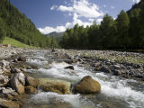 Rocky Mountain Creek with Distant House and Bridge, Qilian Mountains, China Photographie par David Evans