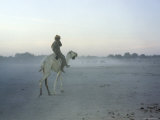 Man on Camel Back Through a Sandstorm, Niger Photographic Print by Michael Fay