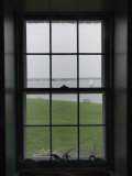 Looking Through the Window of Historic Home to a Sailboat on the Sound, Stonington, Connecticut Photographic Print by Todd Gipstein