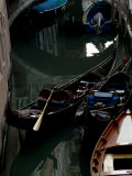 Two Gondolas and a Sandola on a Quiet Canal in Venice, Italy Photographic Print by Todd Gipstein