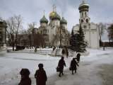 Russian Women, Dressed in Black, Walk Across a Snowy Square Toward Two Orthodox Churches Photographic Print by James L. Stanfield