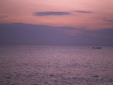Small Fishing Boat in the Distant Water Off the Coast of Jamaica Photographic Print by Stacy Gold