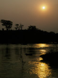 The Tranquil Waters of the Iguazu River Flow Through the Rainforest Photographie par Jason Edwards