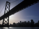 Silhouette of the Skyline and Oakland Bay Bridge, California Photographic Print by Rich Reid