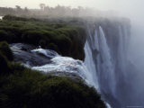 The Iguazu River Cascades over the Precipace into the Misty Abyss Photographie par Jason Edwards