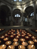 Tray of Lighted Candles in the Chuch of Santa Maria Della Salute, Venice, Italy Photographic Print by Todd Gipstein