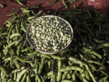 Shelled and Unshelled Green Bean on Red Table at Market in China Photographie par David Evans