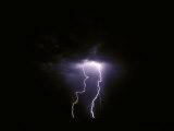 Twin Lightening Forks Slam into a Salt Pan Illuminating the Desert Photographic Print by Jason Edwards