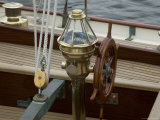 Ship's Wheel and Compass at the Helm of a Wooden Sailboat, Mystic, Connecticut Photographic Print by Todd Gipstein