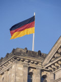 The German Flag Flies High above the New Reichstag in Berlin, Germany Photographie par Jason Edwards