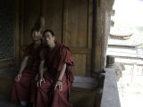 Two Chinese Student Monks Sit Togther on Porch of their Dormitory, Qinghai, China Photographie par David Evans