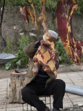 Shy Muslim Butcher Hides Behind Hanging Cuts of Meat, Qinghai, China Photographic Print by David Evans