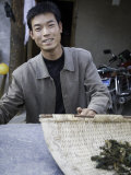 Smiling Young Man in Front of a Motor Bike, Qinghai, China Photographic Print by David Evans