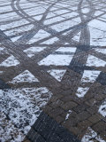 Tire Tracks on Snowy Cobblestone Road, Copenhagen, Denmark Photographic Print by Brimberg & Coulson 
