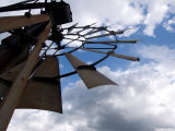 Windmill Stands against a Blue Sky Filled with White, Fluffy Clouds Photographie par Joel Sartore