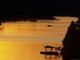 Scenic View of Boat on a Lake a Sunset Photographic Print by Kenneth Garrett