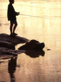 Silhouette of Man Fishing from the Edge of the River, Colorado Photographic Print by Kate Thompson