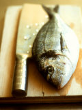 Gilthead Bream on a Wooden Board with Cleaver Photographic Print by Michael Paul