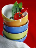 Pile of Soup Bowls with Tomato, Bay Leaf and Chilis Photographic Print by Karl Newedel